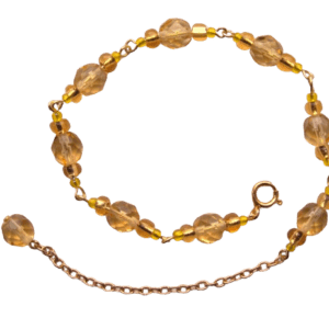 Žlutý korálkový náramek. Hodí se k letním šatům. Doplňte jej broží, náušnicemi nebo sponkou ze stejných korálků.